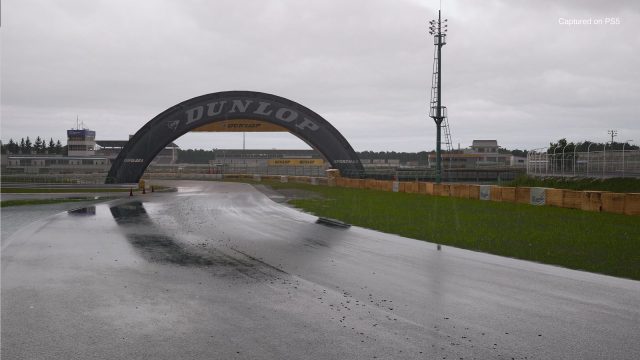 A wet track on a cloudy day in Gran Turismo 7