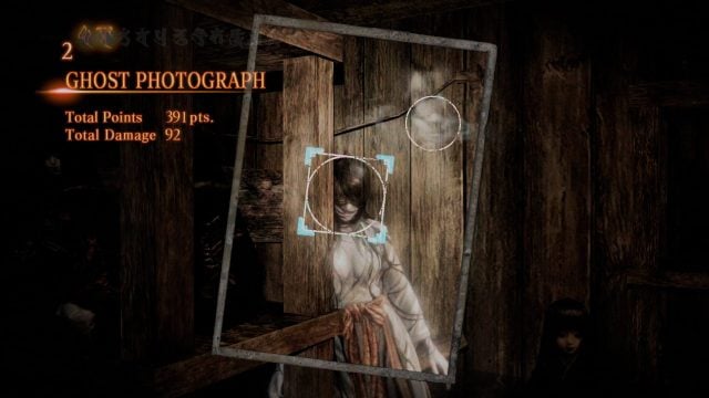 Scoring a ghost photograph in Fatal Frame: Maiden of Black Water