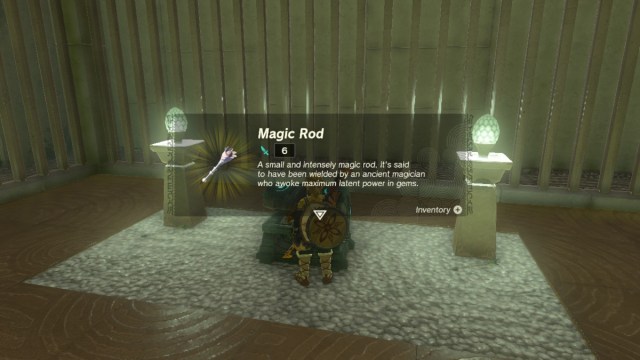 Link retrieving a Magic Rod from a treasure chest in a shrine in The Legend of Zelda: Tears of the Kingdom.