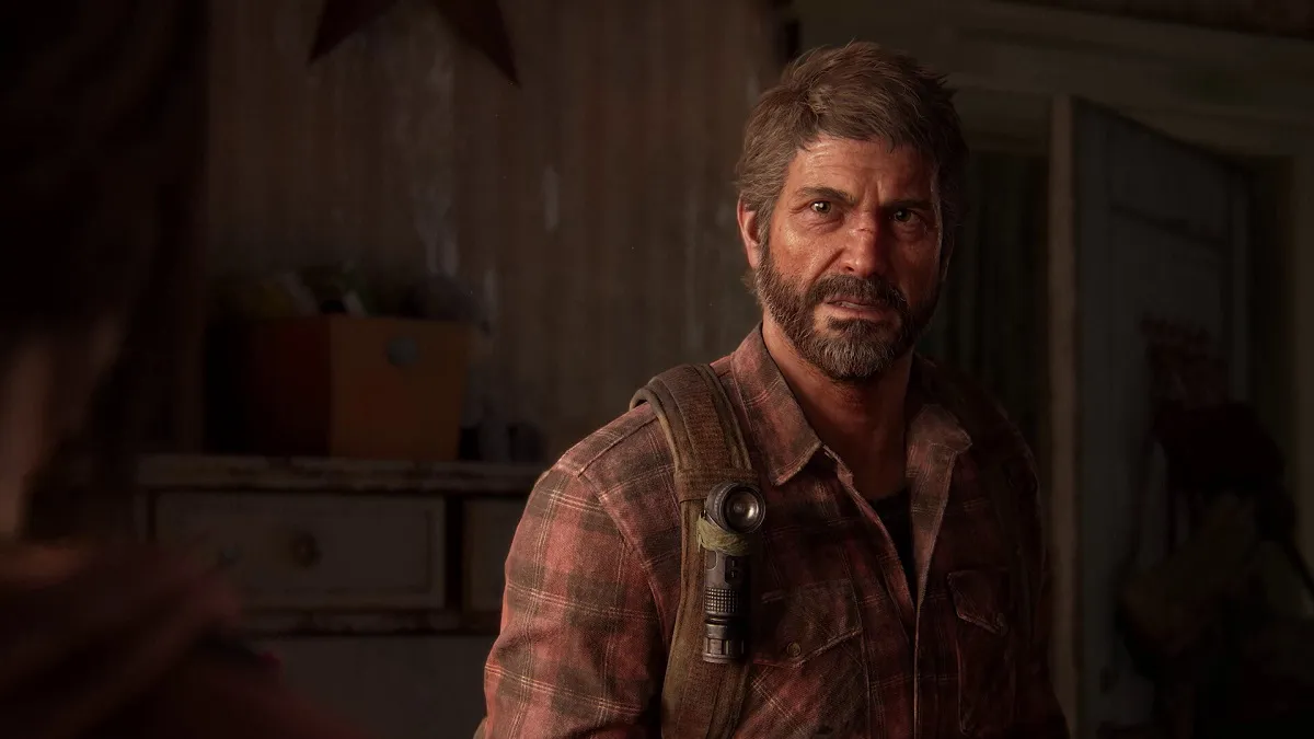 The Last of Us Part 1: Joel looking forlorn.