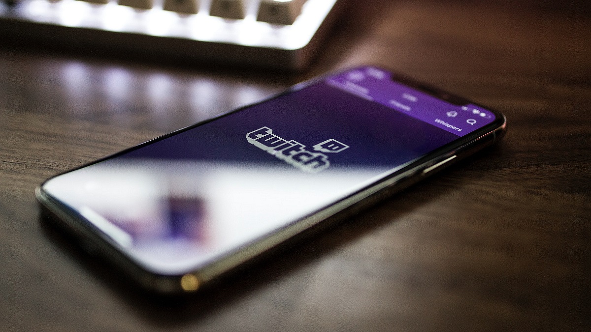 A mobile phone with the Twitch logo on it.