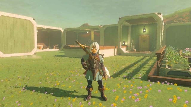 Link standing in front of relaxing house in The Legend of Zelda: Tears of the Kingdom.
