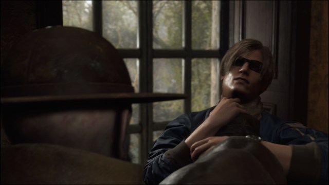 Leon getting choked in Resident Evil 4 Remake.