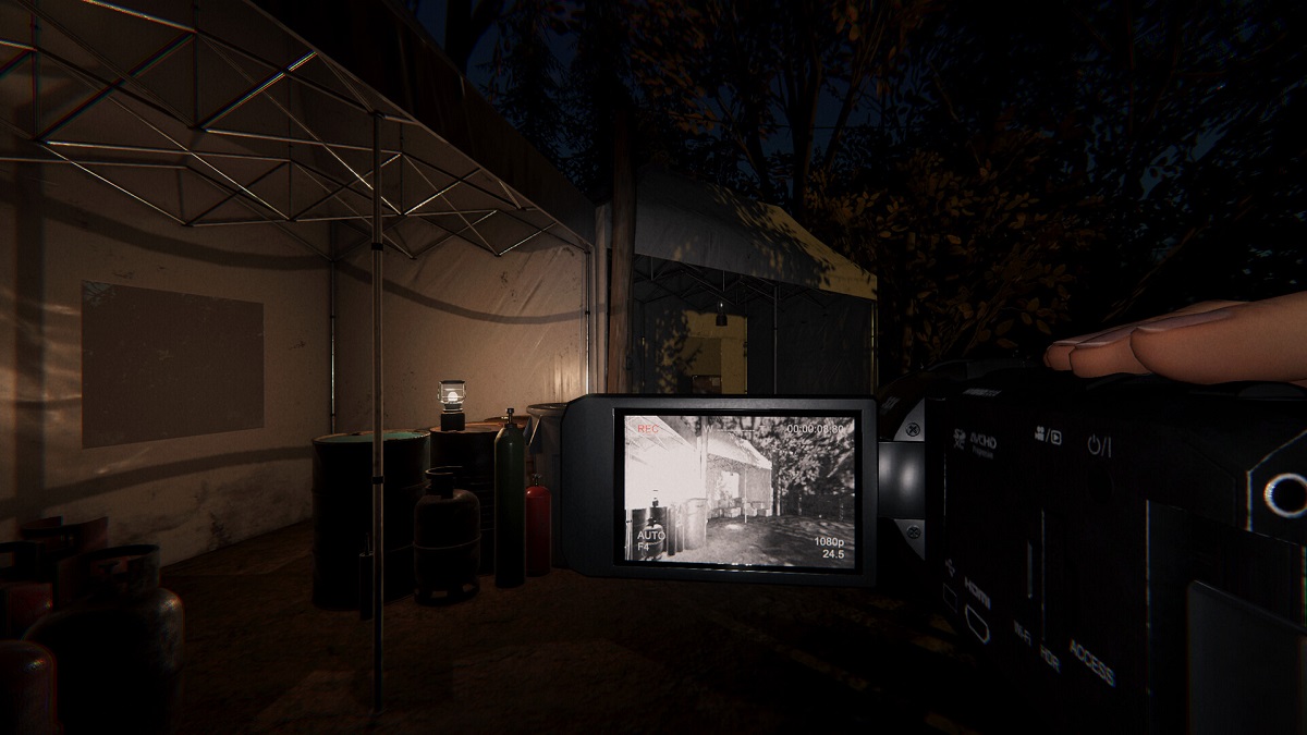 Phasmophobia: The player pointing a night vision camera at a tent.