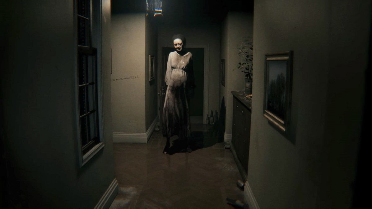 P.T.: Lisa standing creepily at the end of a creepy hallway.