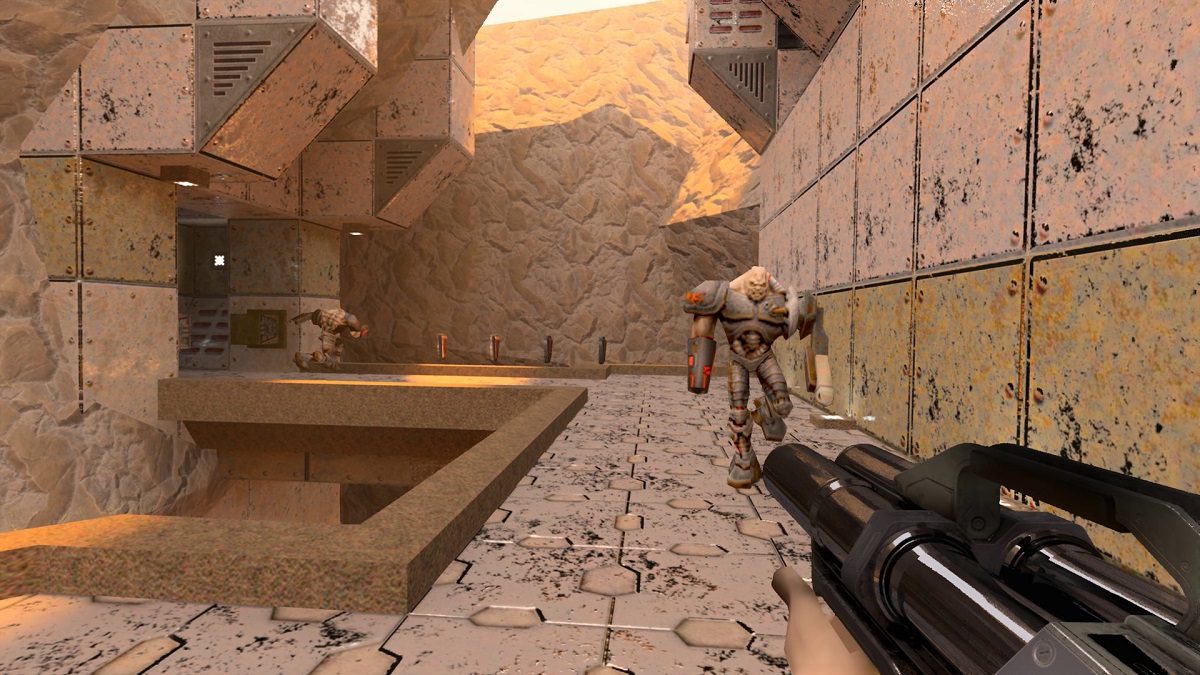 Quake 2 RTX: The player holding the super shotgun as a Gunner heads towards them.
