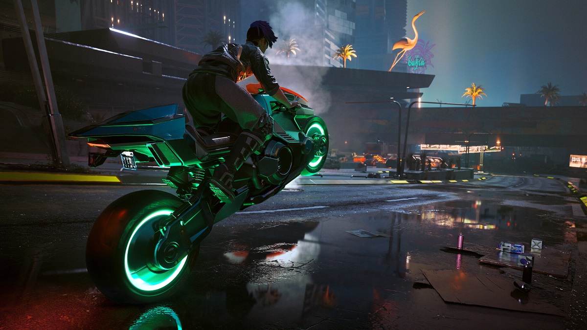 Cyberpunk 2077: a motorcyclist doing a wheelie across a wet road.
