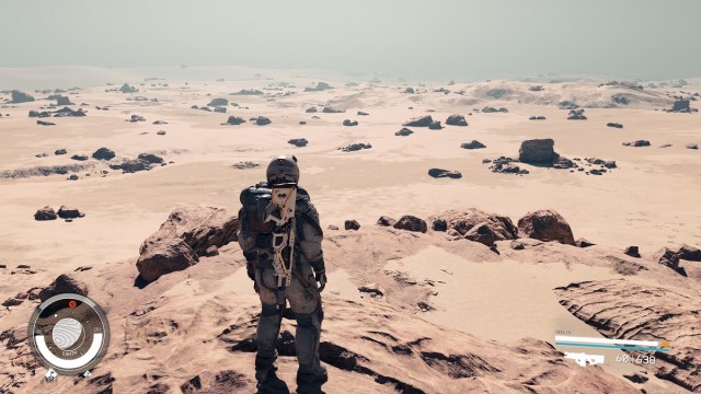 Starfield: an astronaut stood on the desolate plains of earth.