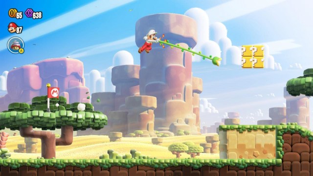 Mario using the Grappling Vine in Super Mario Bros. Wonder