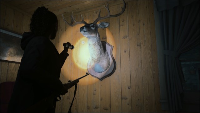 Deer head in Cauldron Lake rental cabin in Alan Wake 2.