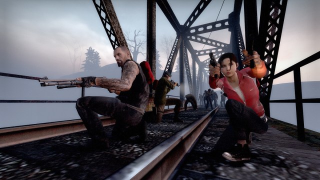 Left 4 Dead: Zoey, Francis, and Bill on a suspension bridge as zombies approach from behind.