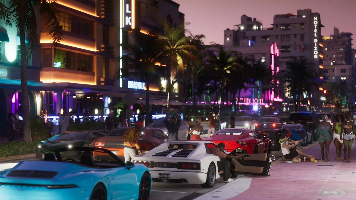 GTA 6: a row of sports cars parked along the side of a busy street at night.