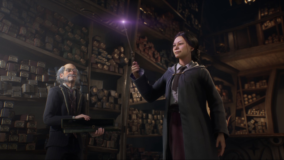 Hogwarts Legacy: a wizard practices with a wand as an old man stands by watching.