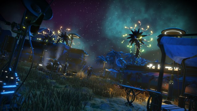 No Man's Sky: a settlement on a planet with the night sky filled with stars.