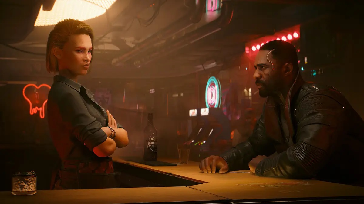 Cyberpunk 2077 Phantom Liberty: Idris Elba's character sat at a dingy bar with a woman opposite.