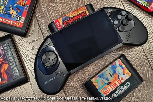 Mega 95: a SEGA Genesis handheld console with an original cartridge in it.