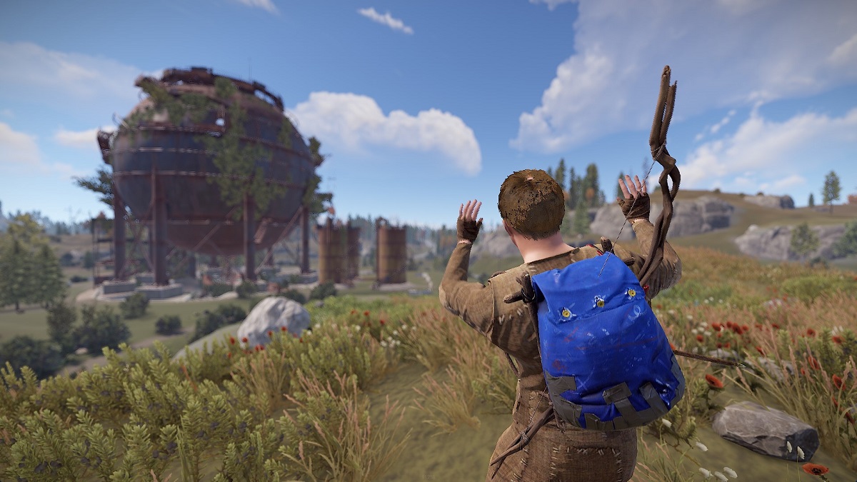 Rust: a survivor on a field wearing a bright blue backpack.