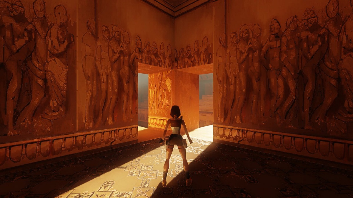 Tomb Raider: Lara Croft stood in a temple with light from a hallway shining through.