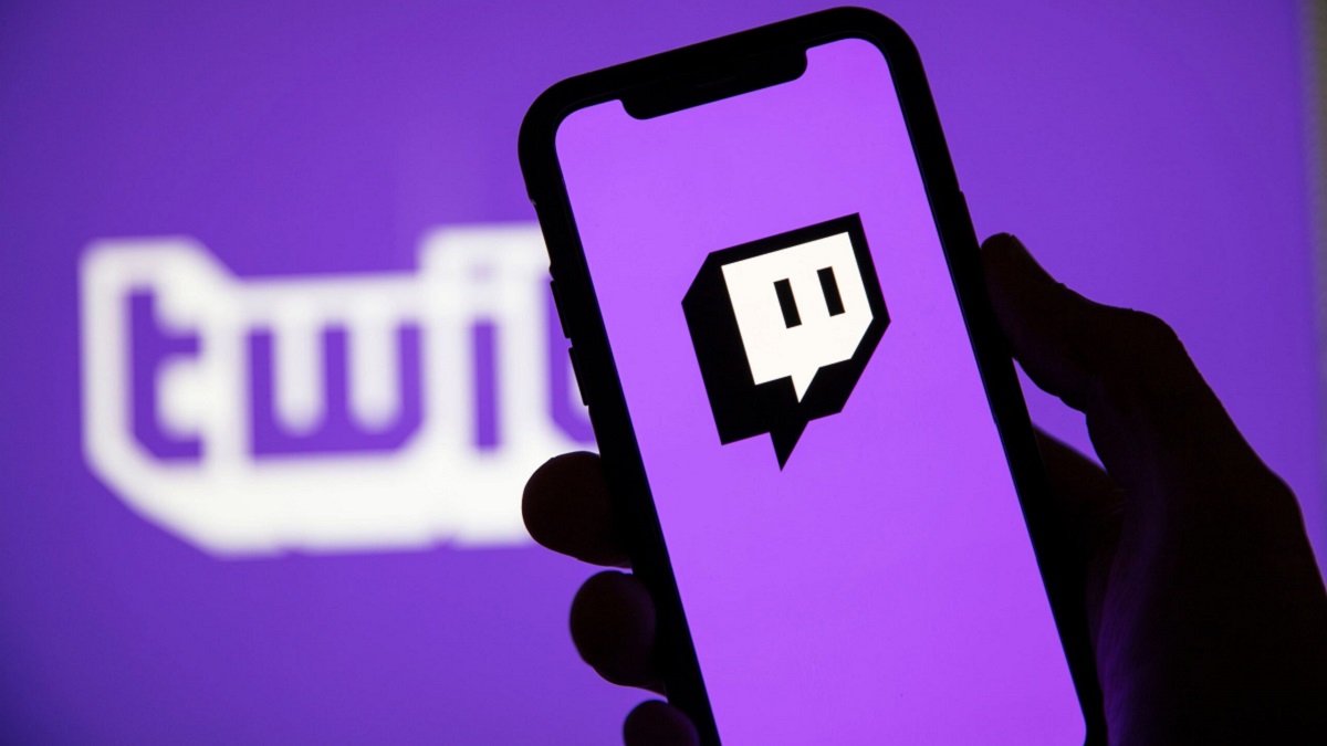 Twitch logo on a phone screen with a bright, purple background.