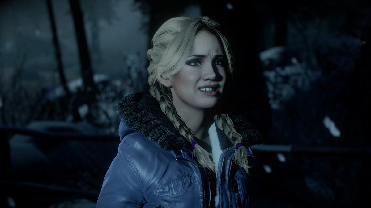 Jessica from Until Dawn, wearing a blue jacket and looking scared.