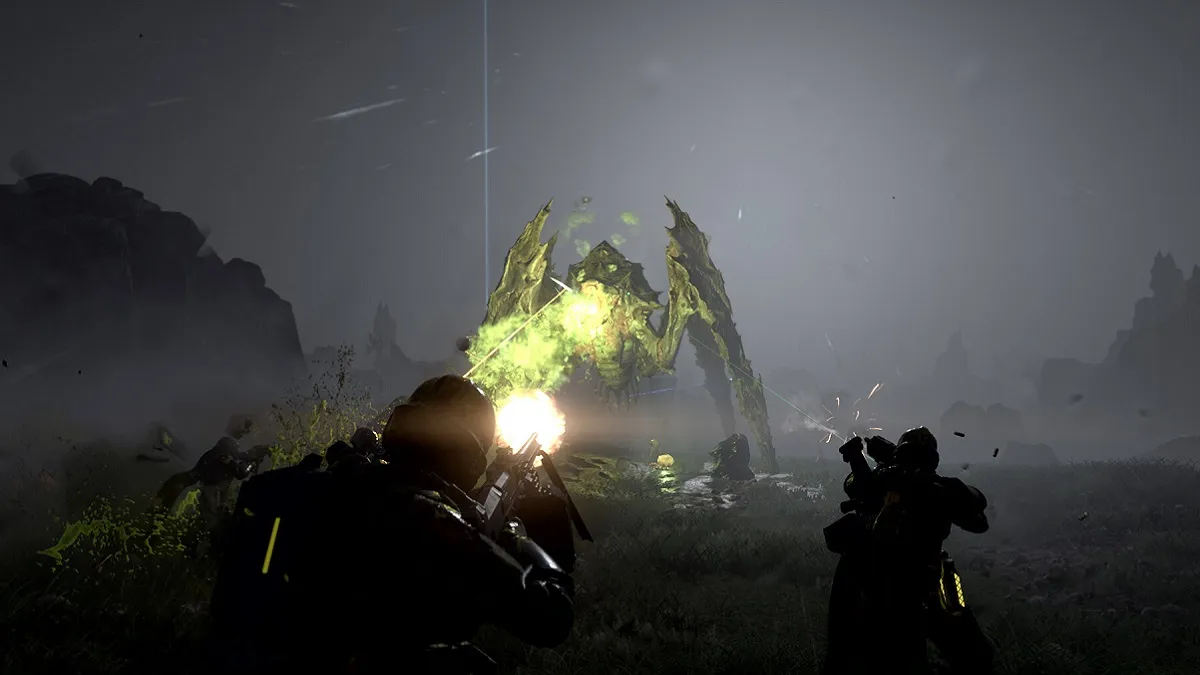 Helldivers 2: silhouettes of soldiers firing at a large, green monster.