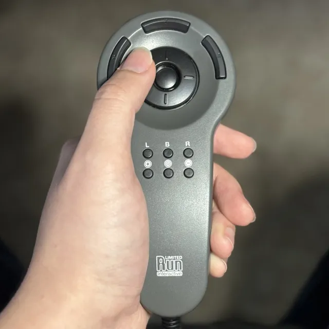 Limited Run Games CDi Spoon Controller and Zoey's hand.
