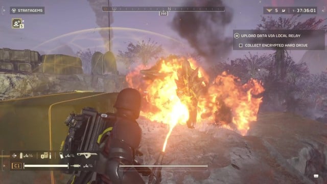 Helldivers 2 Flamethrower charger killer fighting a charger on a hillside