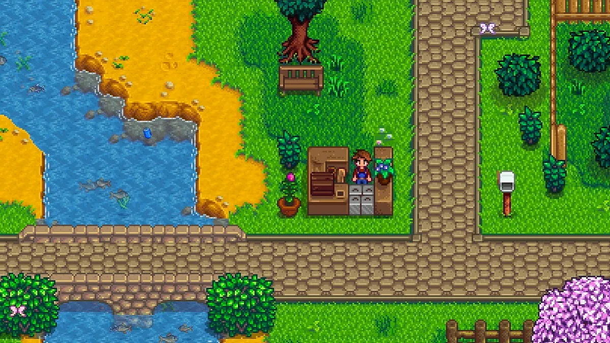 Stardew Valley: the player stood at an outdoor stall by the river.