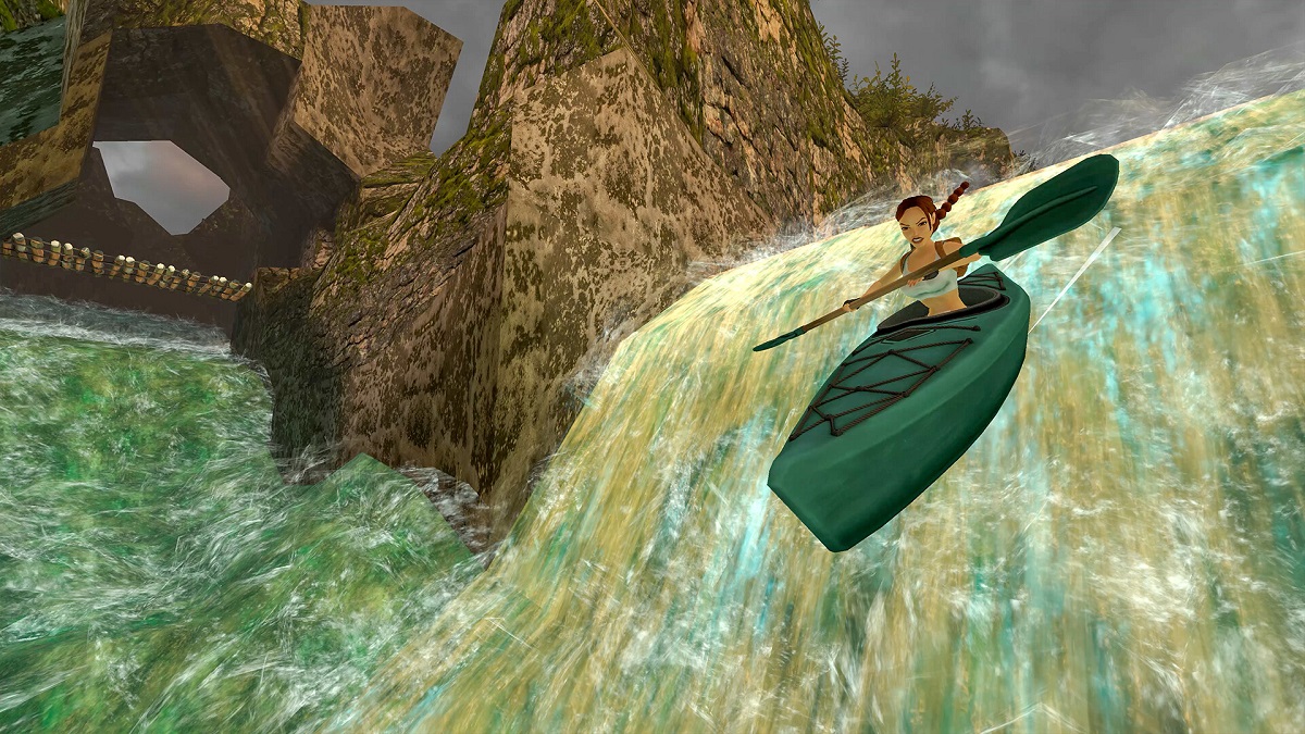 Tomb Raider: Lara Croft going over a waterfall in a kayak.