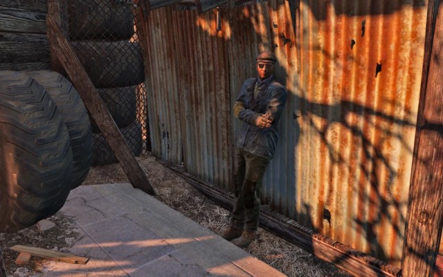 Deacon from Fallout 4 leaning against a wall
