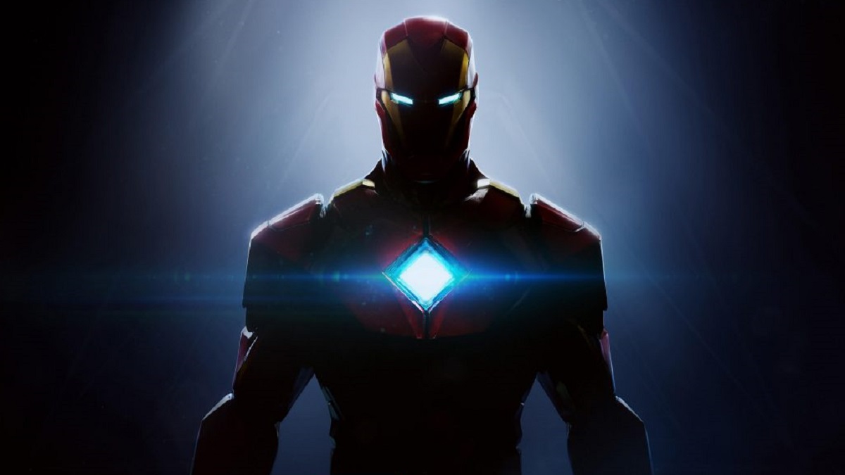 Iron Man in shadows with arc reactor in chest glowing