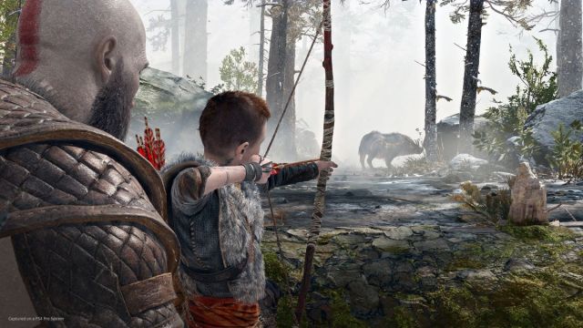 Kratos watching Atreus shoot arrow