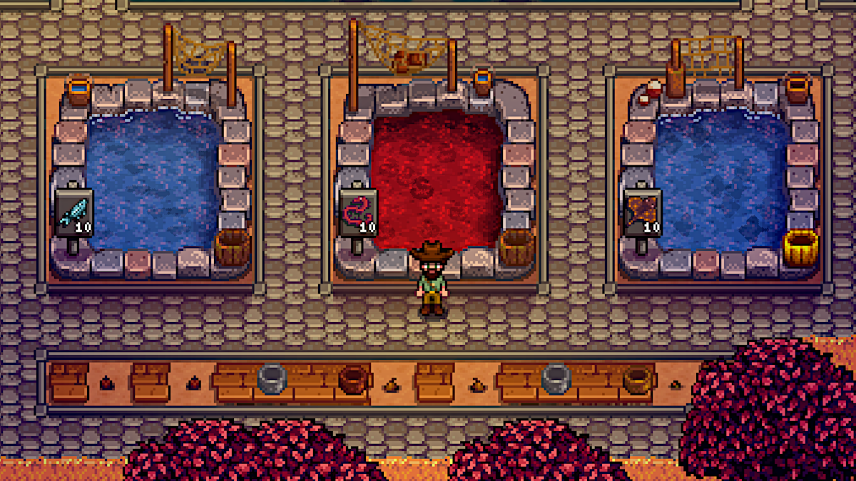 Fish Ponds in Stardew Valley, the right one has a Golden Animal Cracker applied