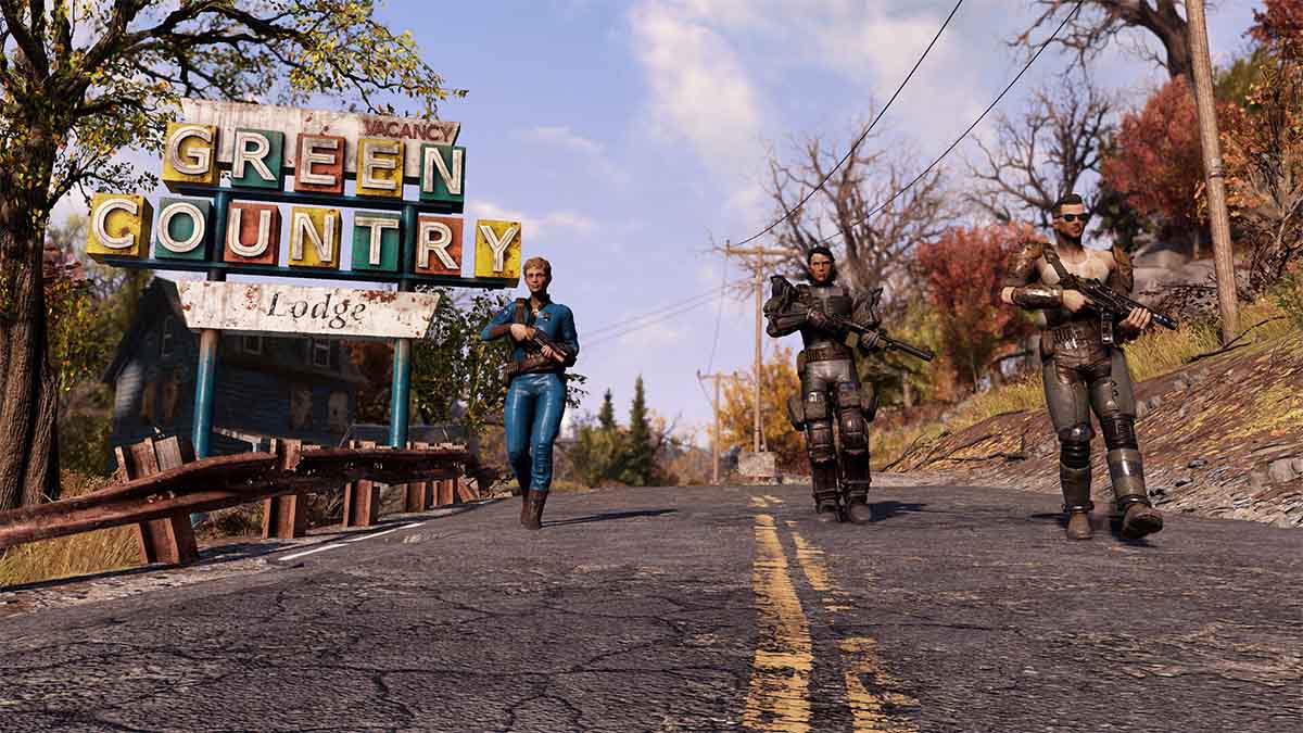 Three Fallout 76 characters walking past a Green Country motel sign.