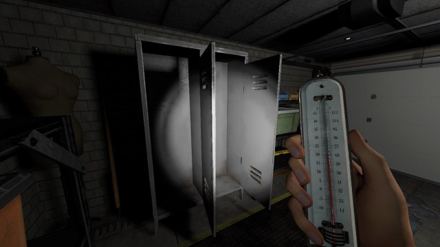 Phasmophobia: a hand holding a thermometer in front of some open lockers in a garage.