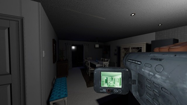 Phasmophobia: the Tier 1 Video Camera showing a night vision image of the dining room in its viewfinder.