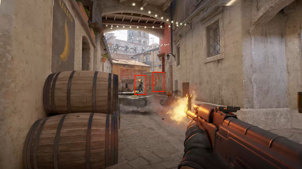 CS2 player firing an AK-47 at an enemy highlighted by a red box.