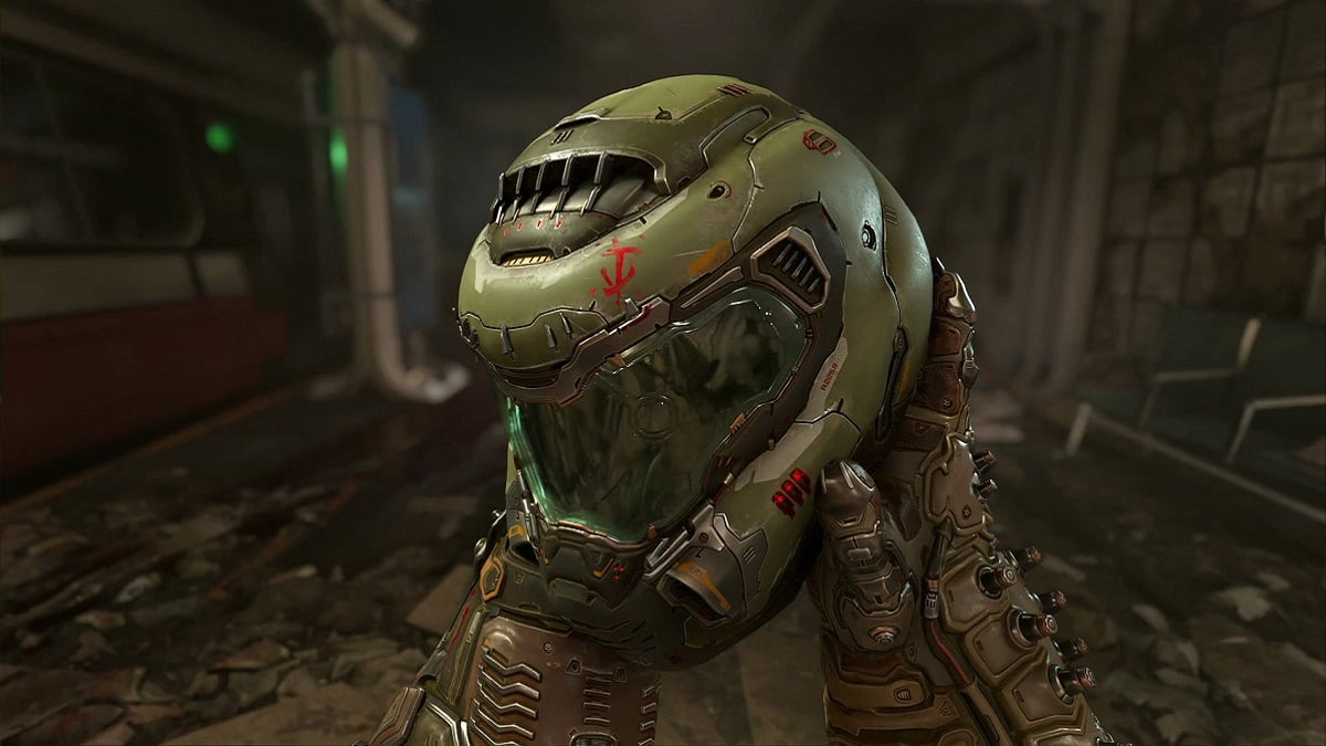 Doom Eternal: the Doom Slayer's hands hold onto his iconic green helmet.