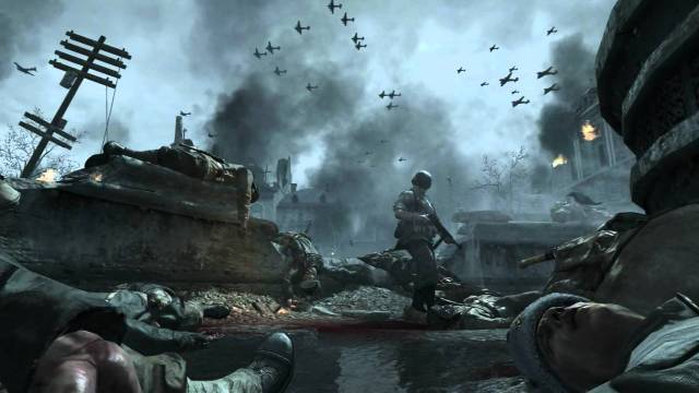 A soldier walking through a water-logged area with planes flying above them. 