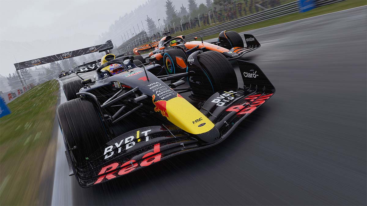 A Red Bull and McLaren car racing in the rain.