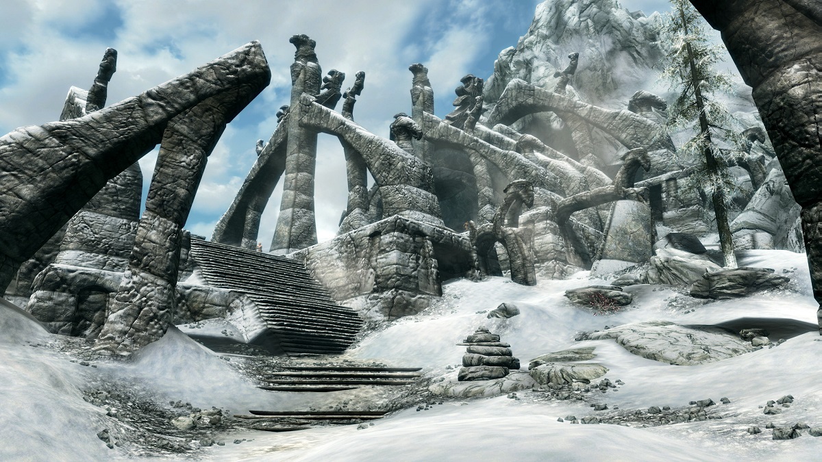 Skyrim: the snowy entry to the stone ruin Bleak Falls Barrow.