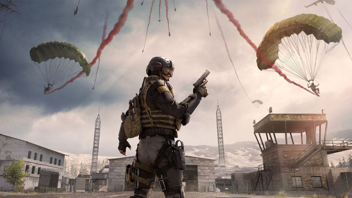 Warzone player holding a pistol while players parachute in front of them.