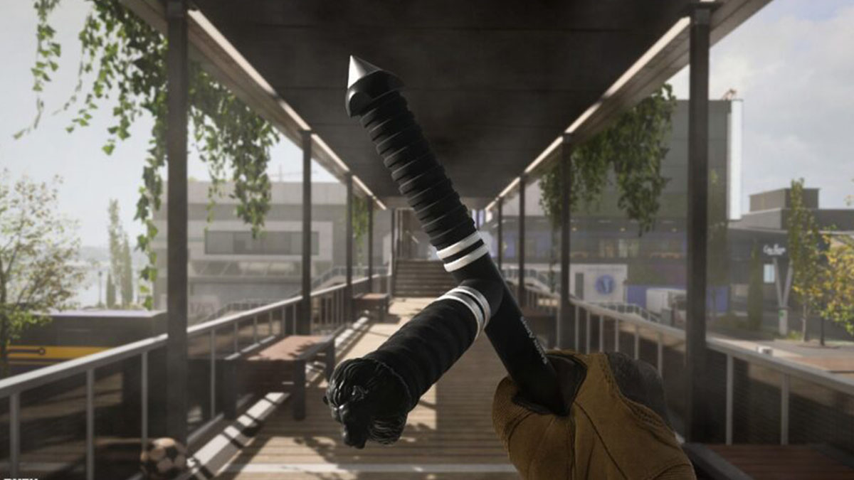 A yellow glove holding a Tonfa stick in Warzone