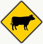 Cattle Crossing road sign in the BitLife driving test