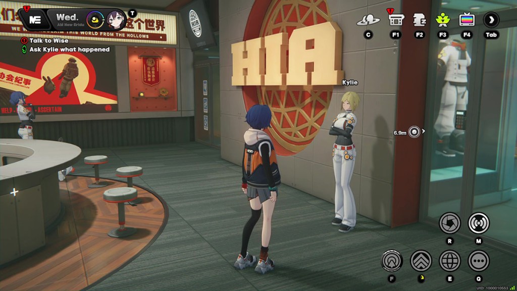 Belle standing with the Kylie NPC in the orange-lit HIA building in Zenless Zone Zero
