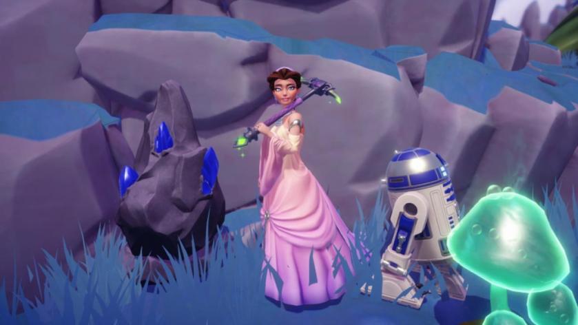 Holding a Pickaxe by a rock node with blue Gems sticking out of it in Disney Dreamlight Valley