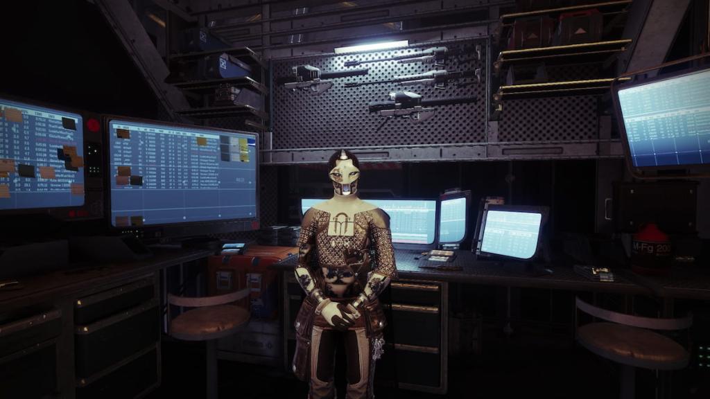 Ada-1, as seen in the shooting range, with bits of machinery and other gear behind her.