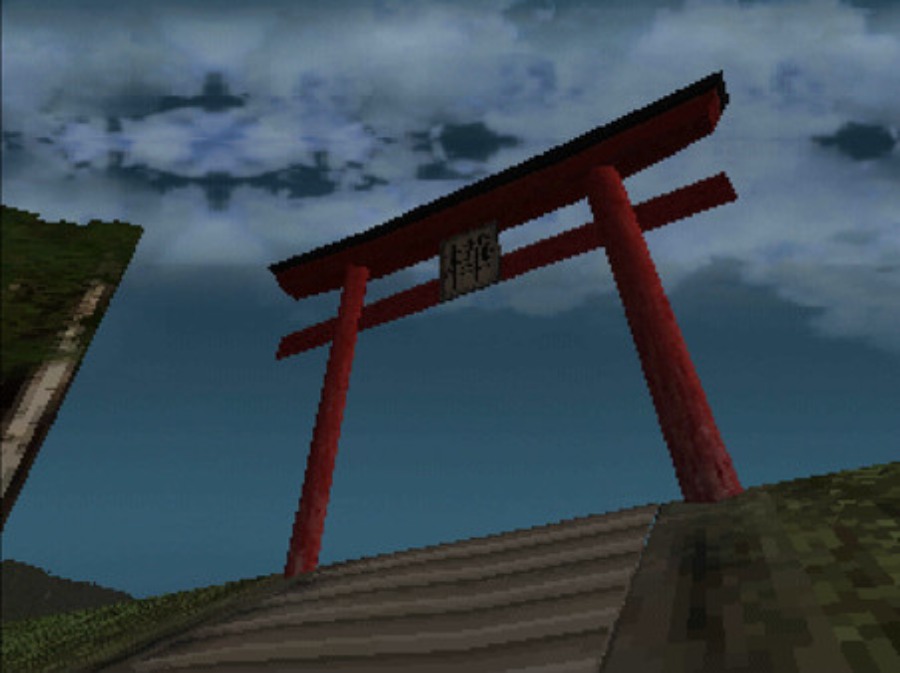 Looking up at a tori gate atop a staircase