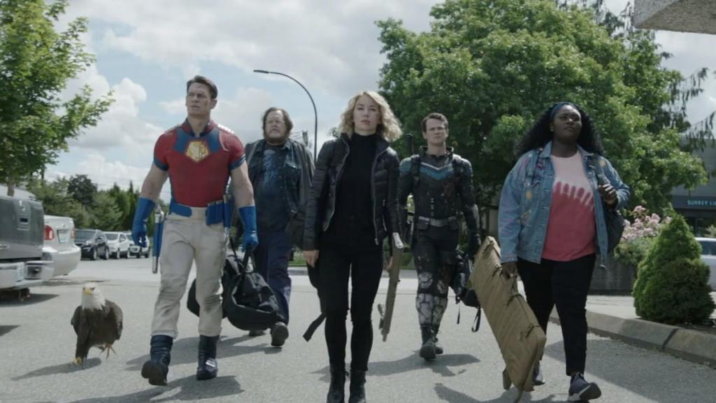 Peacemaker and his friends walking in a parking lot