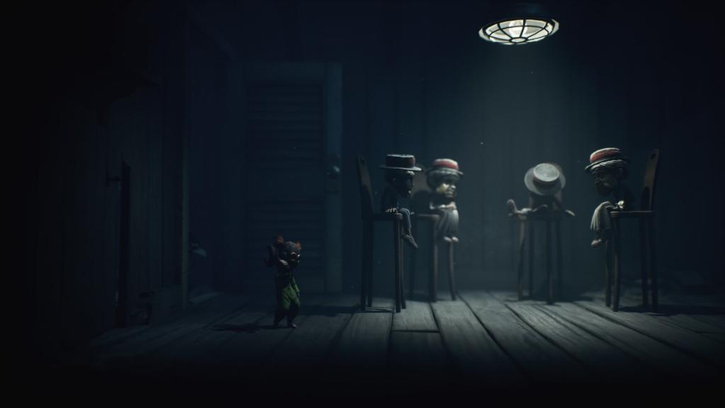 The Puppets sitting on some chairs